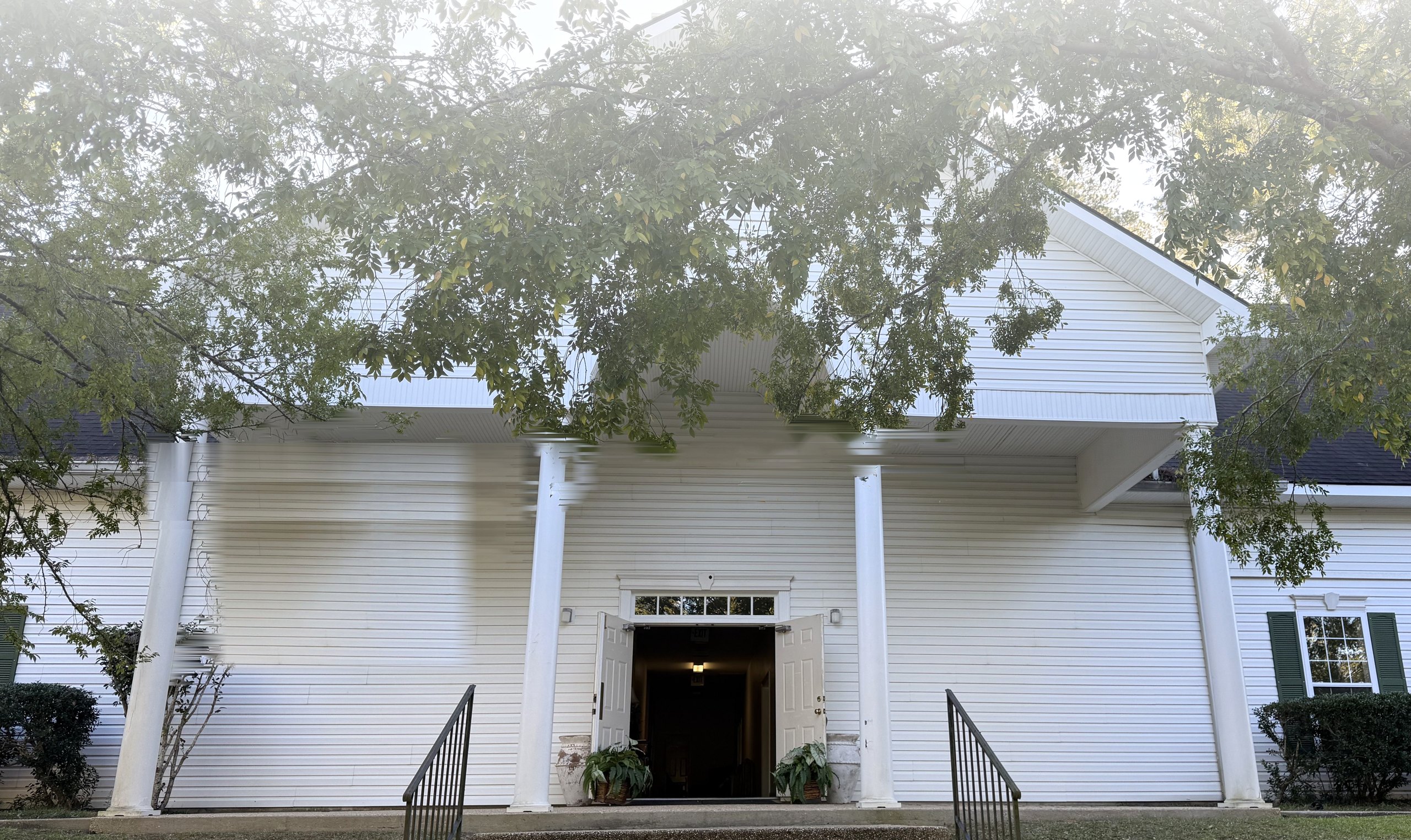 Front entrance of Faith PCA in Clinton, LA, with the doors open